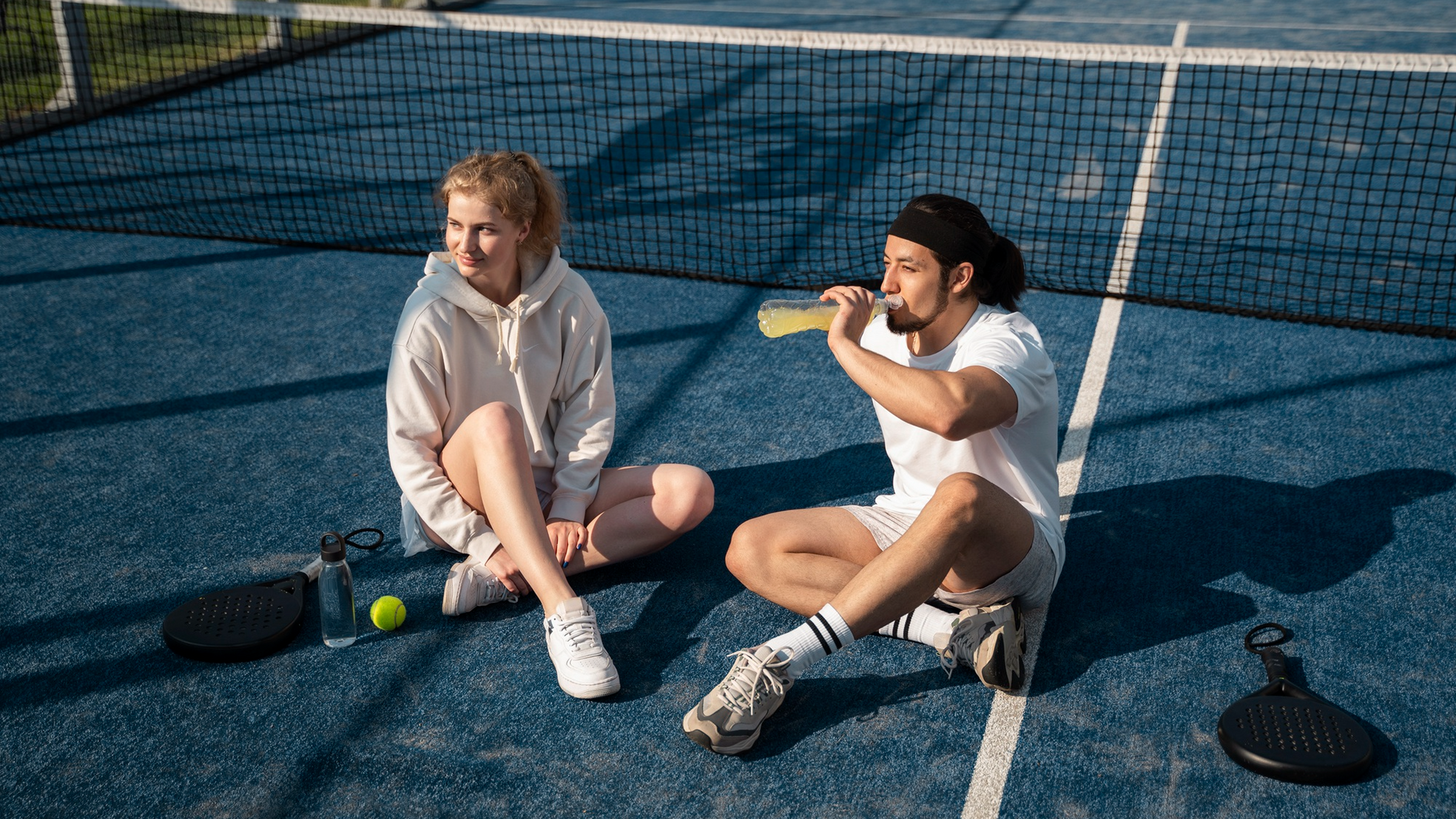 Players relaxing on a sports court